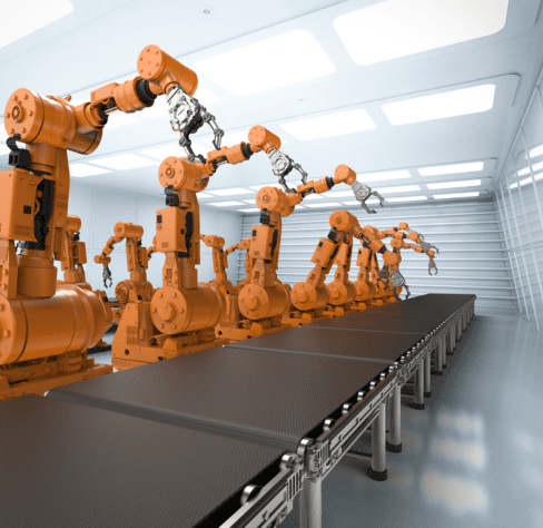 Orange robot arms lined up next to assembly line, ready to automate a workflow.