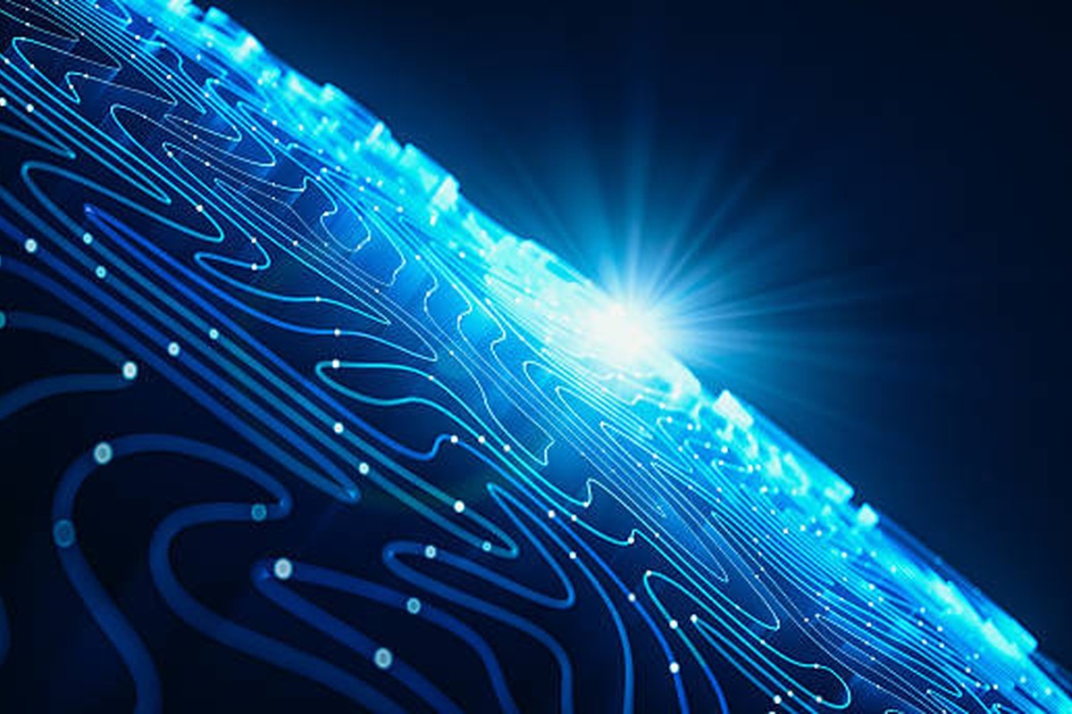 A glowing blue digital circuit pattern forms curved lines on a dark surface, with bright light rays shining from the background, evoking a futuristic technology or identity access concept.