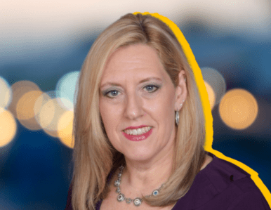 A woman with straight blonde hair, wearing a purple top and a silver necklace, smiles at the camera. The background is blurred with bokeh lights, and there is a yellow outline around her silhouette.