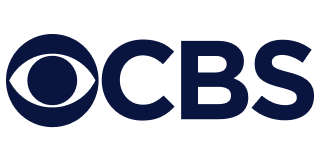 CBS logo featuring a stylized eye symbol to the left of the bold, dark blue letters CBS on a light gray background.