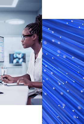 A person wearing glasses works at a computer in a modern office, focusing on Healthcare Identity Management, while the right side of the image features abstract blue fiber optic lights.