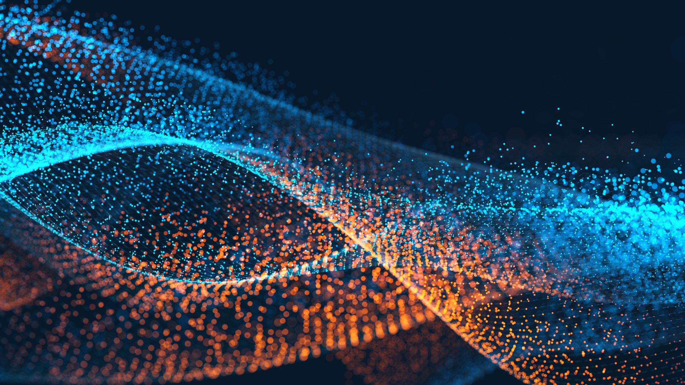 Abstract digital image of intertwining blue and orange light particles forming wave-like shapes on a dark background, creating a sense of motion and fluidity.