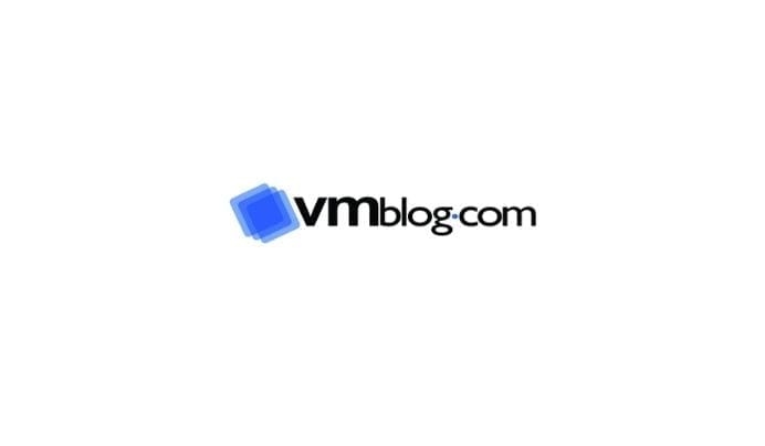 The image displays the vmblog.com logo with vm in bold black letters, blog.com in regular black text, and a blue layered square graphic to the left of the text. The background is white.